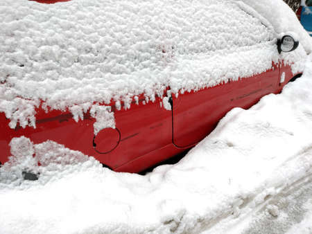snow covered car in the winterの写真素材