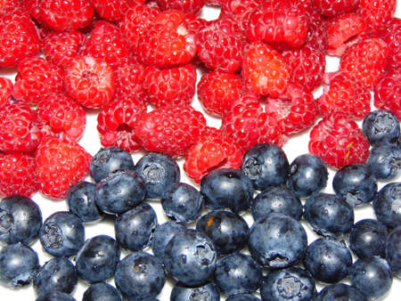 raspberries and bilberries fruits - fresh fruitsの写真素材