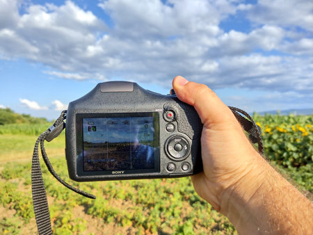 a man takes a picture with the camera. Photography concept