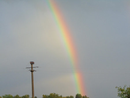Natural rainbow after the rain in Maramures county, Romaniaの写真素材