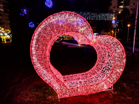 Red heart made of lights in Baia Mare. Christmas decorationsの写真素材
