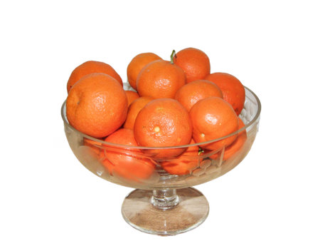 Clementines in a glass bowl. Group of clementines isolated on whiteの写真素材