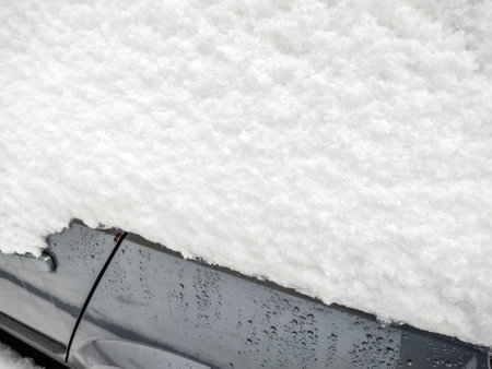 Snow on a car in the winter. In Romaniaの写真素材