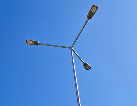 Lighting pole and a blue sky in the backgroundの写真素材