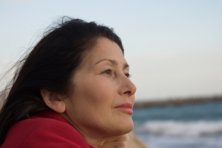 Portrait of the woman enjoying an autumn sunlightの写真素材