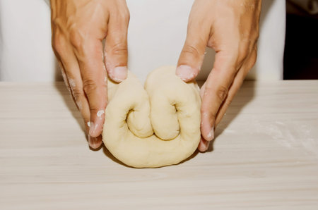 Hands kneading a dough
