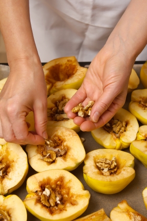 Preparation of quince with honey and nutsの写真素材