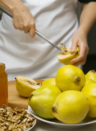 Preparation of quince with honey and nutsの写真素材