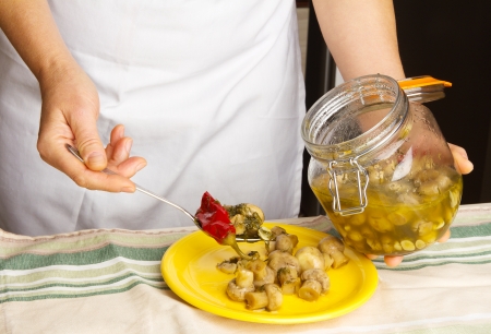 Preparation of marinated mushrooms Home in the kitchen の写真素材