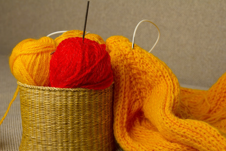 Multicolored yarn in wicker basketの写真素材