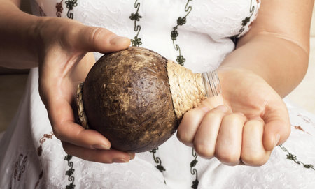 Woman hands getting coconut oilの写真素材