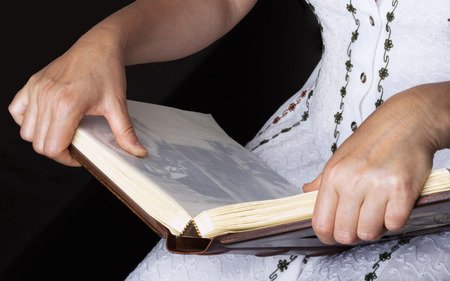 Woman browsing photo albumの写真素材