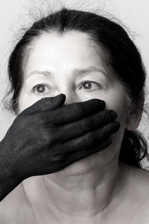 Tied mouth and blindfold eyes.Censored and freedom of speechの写真素材