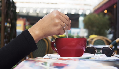 Hand holding cup of coffeeの写真素材