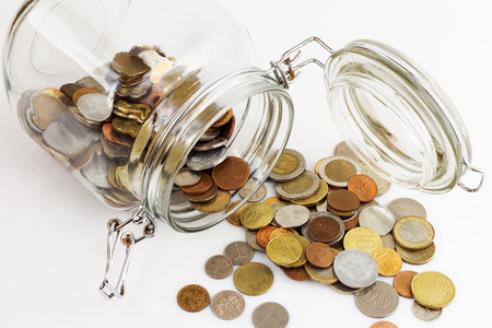 Money jar, white backgroundの写真素材