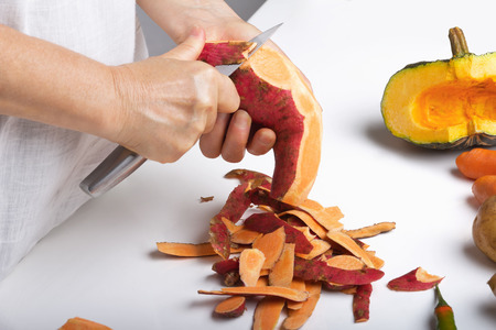 Cutting sweet potatoesの写真素材