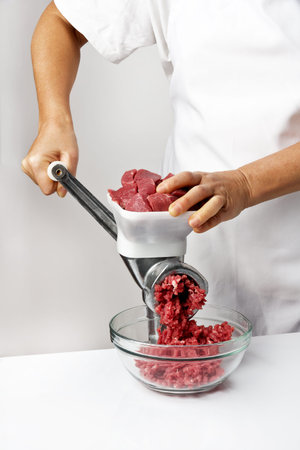 Cooking ground beef in a meat grinder