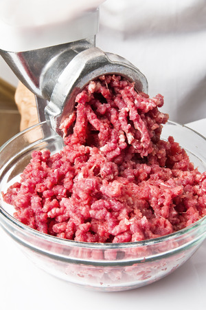 Cooking ground beef in a meat grinderの写真素材