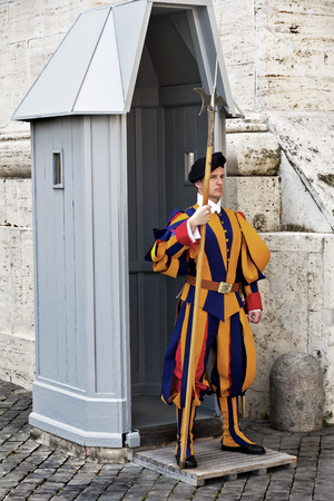 Rome, Vatican, Italy - April 14, 2017: Papal Swiss Guard in their traditional uniform stands at the entrance of Saint Peter's Basilicaのeditorial素材