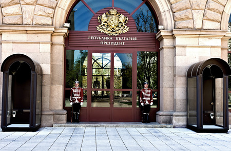 Sofia, Bulgaria - April 10, 2017:  Honor guards stand in front of the door to President's Office.The guards are dressed in a white and red dress uniform, which the royal guard wore back in the 19th century.のeditorial素材