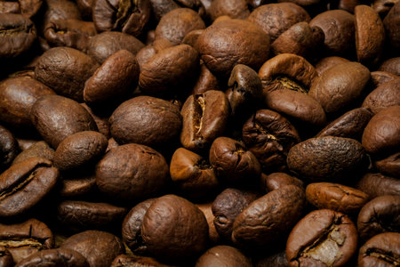 Coffee beans background. Fried coffee on grunge wooden background.の写真素材