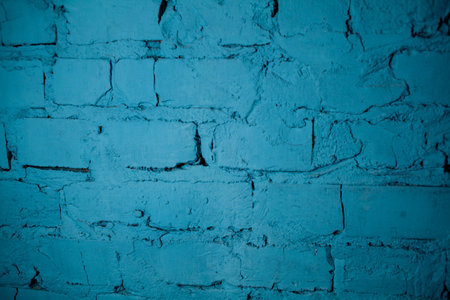 Background of old vintage blue brick wall. Street light blue brick wall. Blue wall. Old school style blue brick wall.の写真素材