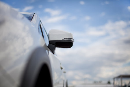 Bumper, Front of the white sports car.The car is on the road.Element for design.The headlight of the new clean white sports car has an aggressive shape with a piece of bonnet and black wheel, a bumperの写真素材