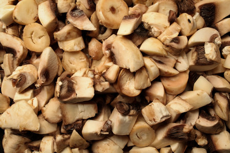 pieces of mushrooms in a pan. pieces of raw mushrooms in a pan. cooking raw mushroomsの写真素材