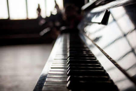 Keyboard piano close up photo, soft focus. Beautiful close up photo of piano keys. Piano keys close up photo selective focus. Piano keyboard close up side view, stock photoの写真素材