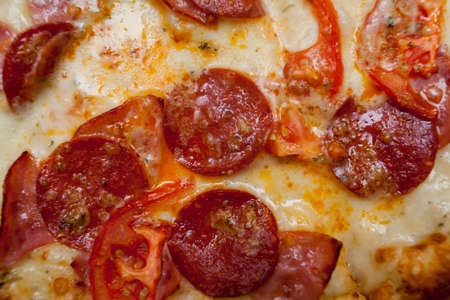 slice of delicious pizza with sausage, pepperoni and cheeseの写真素材