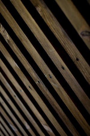 Natural Wood Texture Background. Almond Tree Wood Grained Texture. Dark Wooden Background. old scratched wooden oak board with cracks, vintage background. Old scratch wood wall texture backgroundの写真素材