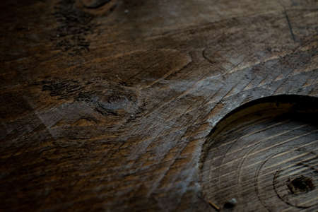 Natural Wood Texture Background. Almond Tree Wood Grained Texture. Dark Wooden Background. old scratched wooden oak board with cracks, vintage background. Old scratch wood wall texture backgroundの写真素材