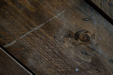 Natural Wood Texture Background. Almond Tree Wood Grained Texture. Dark Wooden Background. old scratched wooden oak board with cracks, vintage background. Old scratch wood wall texture backgroundの写真素材