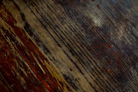 Old scratch wood wall texture background. old scratched wooden oak board with cracks, vintage background. Natural Wood Texture Background. Almond Tree Wood Grained Texture. Dark Wooden Background.の写真素材