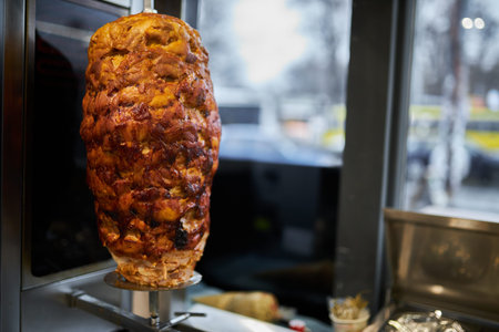 shawarma, lamb on a spit. street food. Doner Kebab on a rotating spit. A street food of Turkey....