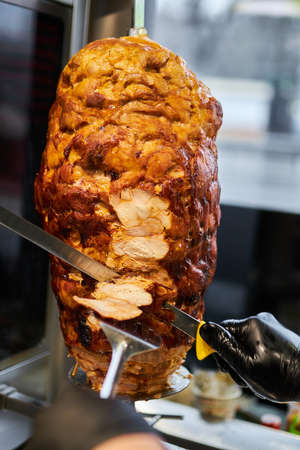 shawarma, lamb on a spit. street food. Doner Kebab on a rotating spit. A street food of Turkey.の写真素材