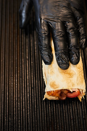 the cook prepares shawarma. cooking shawarma. street eatery.の写真素材
