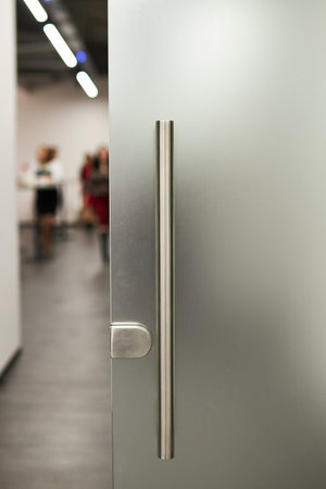 Glass frosted door with a metal handle. glass door. Frosted glass backgroundの写真素材
