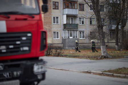 Kiev, Ukraine, November 20, 2021: a group of firefighters. firefighters pass by the house....