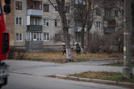 Kiev, Ukraine, November 20, 2021: a group of firefighters. firefighters pass by the house. firefighters in gear go to extinguish the fireのeditorial素材