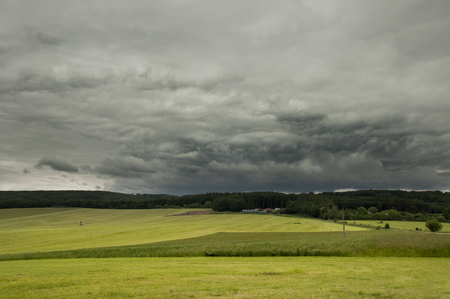Meadow with dramatic sky aboveの写真素材