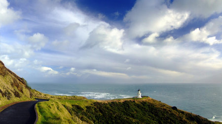 View on Cape Renga and ocean with white cloudsの写真素材
