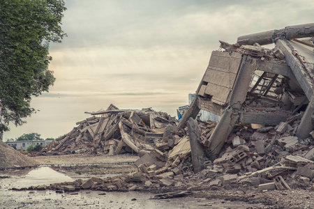 Collapsed industrial concrete building with plenty of ruins.