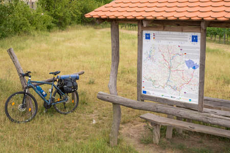 Cizov Czech Rep 23th June 2018 EuroVelo 13, bicycle with bags standing by the rest of the Iron Curtain at Czech - Austrian borders, south Moravia. The Iron Curtain Trailのeditorial素材