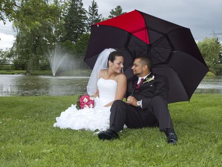 Just married multi ethnic couple looking at each otherの写真素材