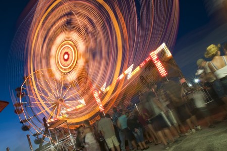 People wating in line at the amusement park to get on the ridesの写真素材