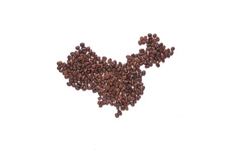 The contours of China lined with coffee beans on a white isolated background.の写真素材