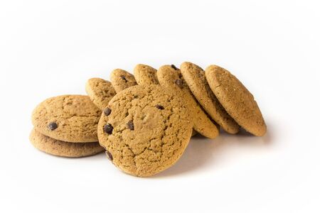 A pile of cookies with chocolate chips on a white isolated background.の写真素材