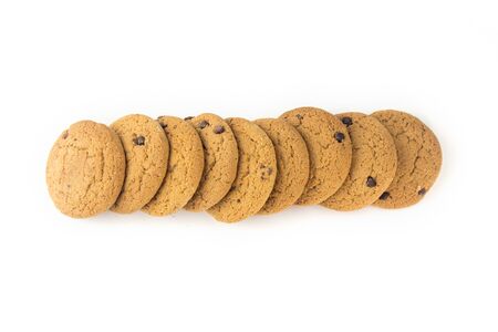 Homemade cookies with chocolate laid out in a horizontal line on an isolated light background..の写真素材