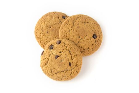 Three oatmeal cookies with chocolate chips on a white background view from the top.の写真素材